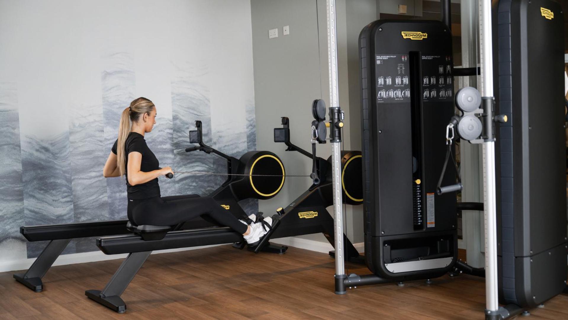The Culloden Estate And Spa Holywood  Eksteriør billede A woman using a rowing machine